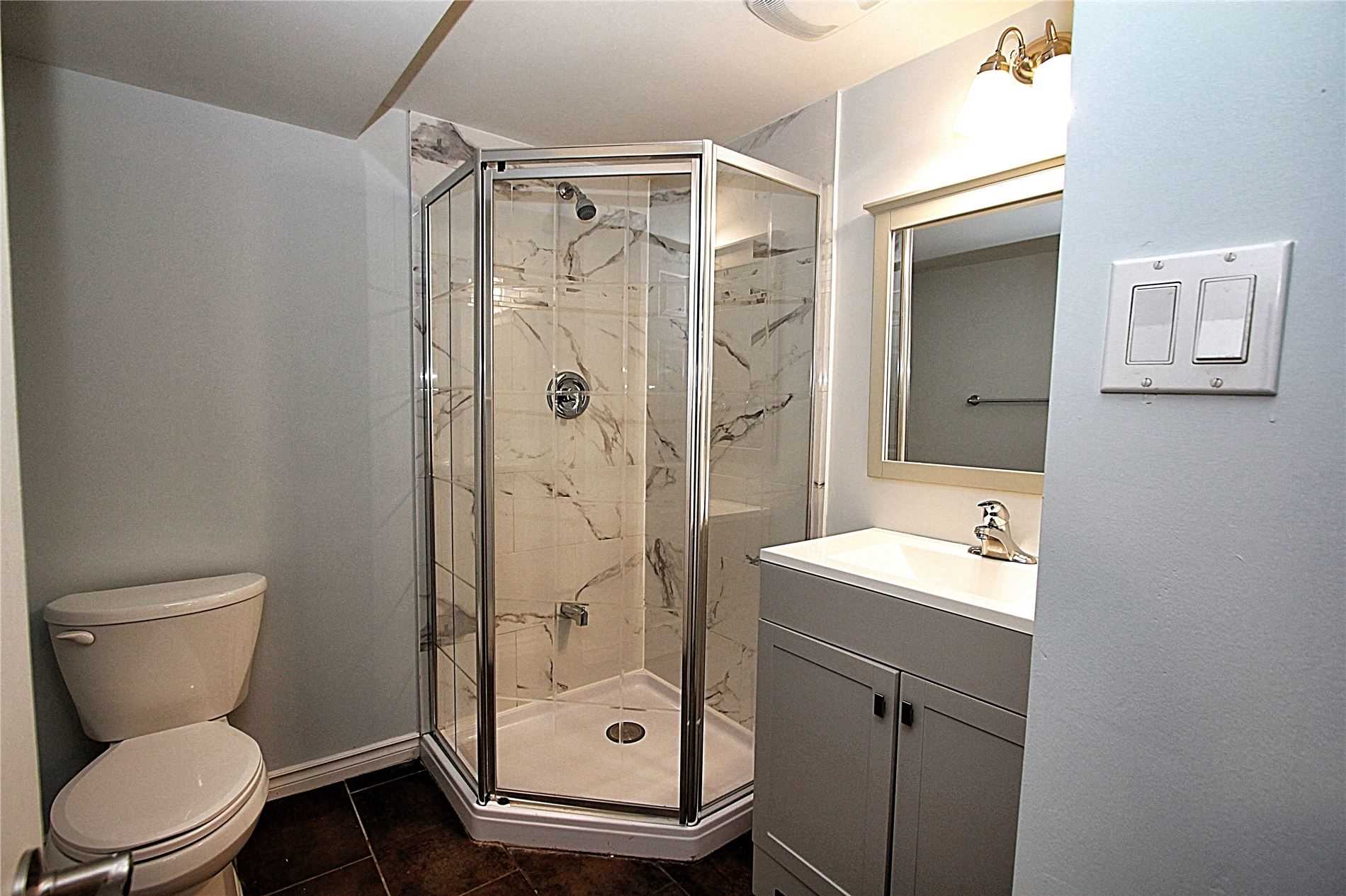 Basement bathroom with corner shower